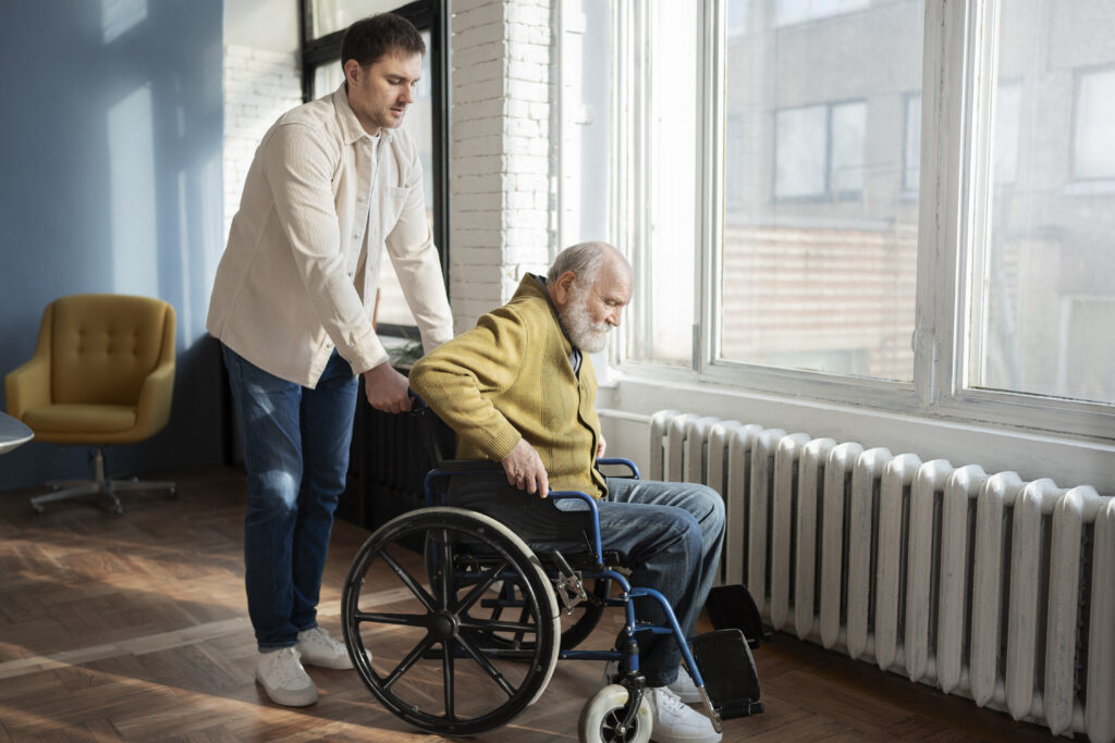 Support worker assisting a person with disability during daily activities, representing practical and compassionate disability services.

